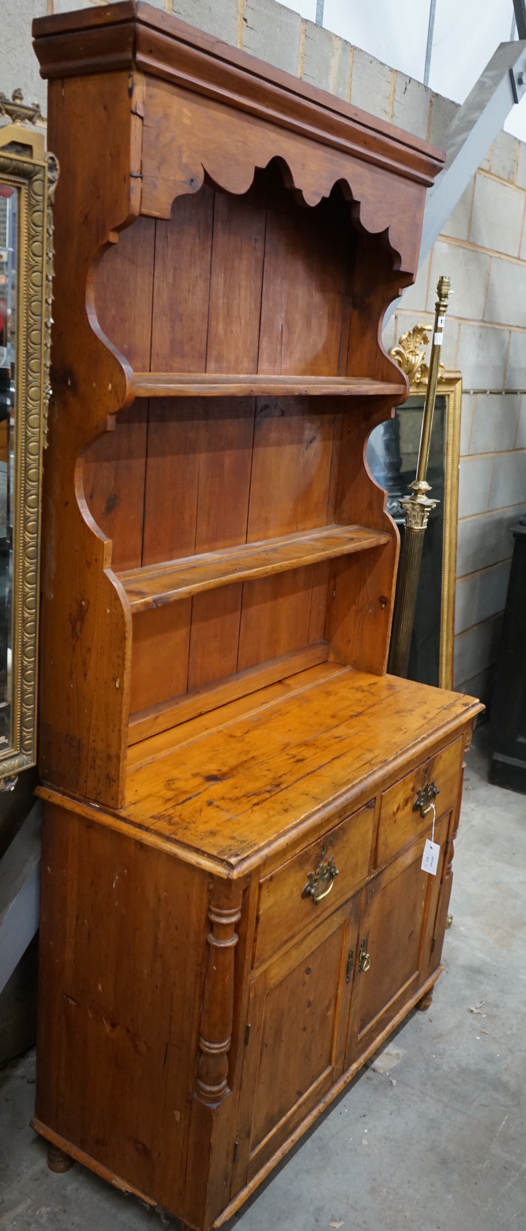 A small Victorian pine dresser, width 95cm depth 41cm height 193cm